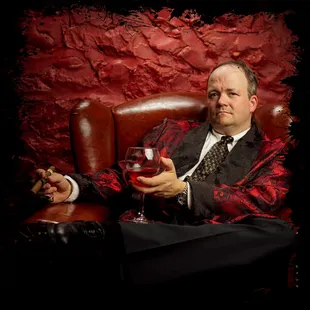 a man holding a glass of wine