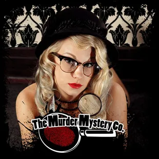 a woman with glasses and a hat