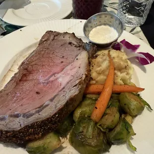 Prime rib, garlic mashed potatoes, roasted Brussel sprouts and carrots