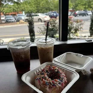 Christmas in a cup, cold brew with salted cold foam, and a strawberry glazed donut