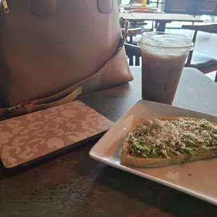 Avocado toast , light reading and coconut  coffee