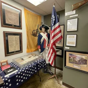 Revolutionary War display with American Flag