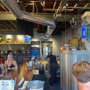 Inside at the bar + bartender