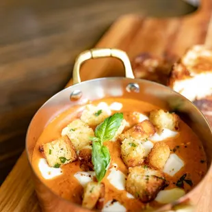 a pan of soup and bread