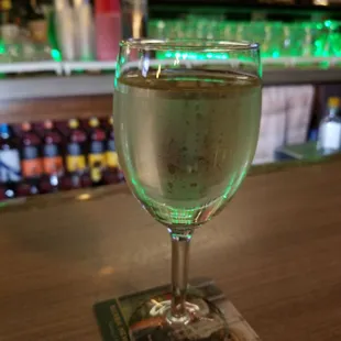 a glass of water on a bar