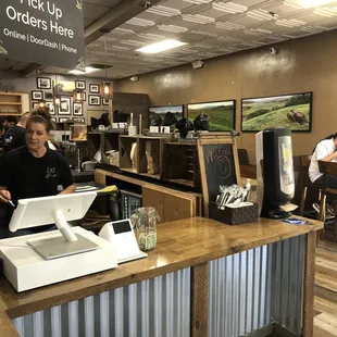 A busy fast moving team assembles sandwiches, you can eat-in or pickup your order here.