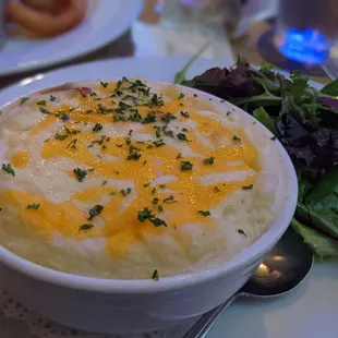 a bowl of soup and a salad