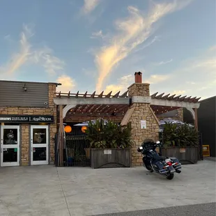a motorcycle parked in front of the restaurant