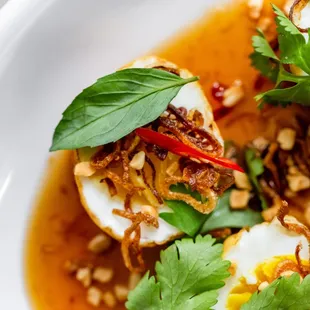 Forbidden Eggs, Crunchy, sweet &amp; spicy eggs, sweet chili sauce, cilantro, thai basil, crispy shallots