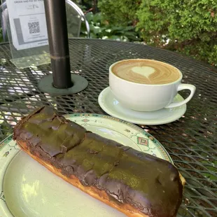 Donut and a latte on a warm summer&apos;s morning!