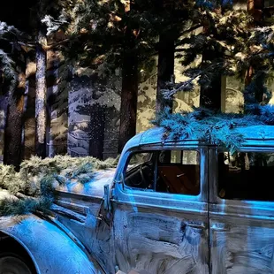 Opel Sedan civilian car utilized by the German military camouflaged with winter branches - National WWII Museum