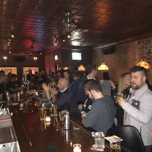 a large group of people at a bar