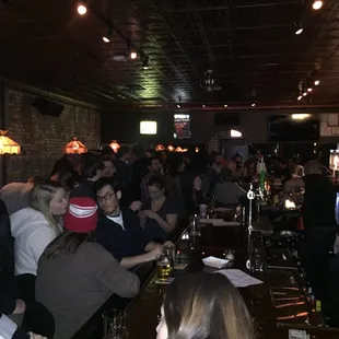 a large group of people at a bar