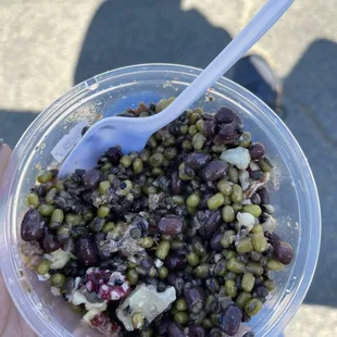 a person holding a bowl of food