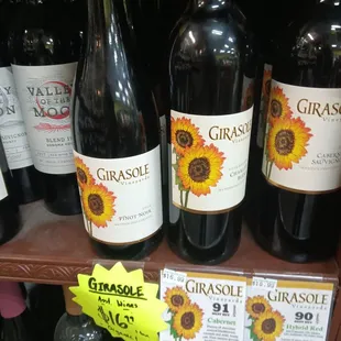 several bottles of wine on a shelf