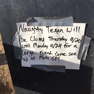 a sign on a trash can