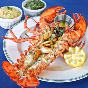 BAKED STUFFED LOBSTER
 Baked Maine Lobster Stuffed with Shrimp and Scallops, Topped with Cracker Crumbs. Served with Drawn Butter &amp; 2 Sides.