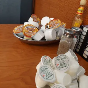 a plate of coffee pods and cups