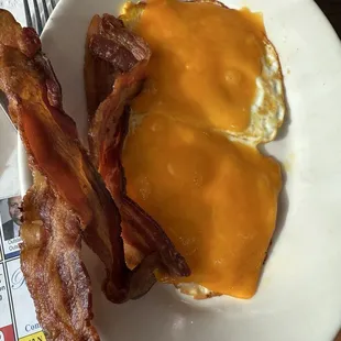 I ordered scrambled eggs with cheese and this is what I got along with crispy bacon