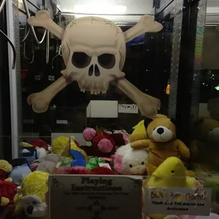 a pile of stuffed animals and a skull