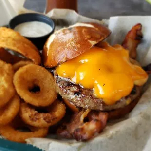 The cheesehead burger with up priced onion rings