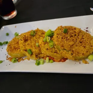 Fried green tomatoes served with red pepper cream sauce. A nice shareable starter.