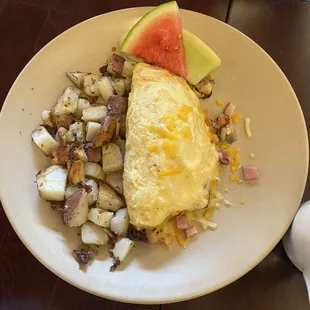 3 egg omelet with ham, mushrooms &amp; jalapeños. Potatoes &amp; sourdough (not pictured). Delicious