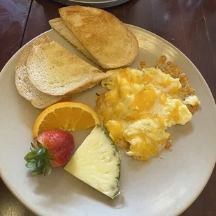 Kids scrambled eggs &amp; cheese sourdough &amp; fruit garnish. $7, kid approved!