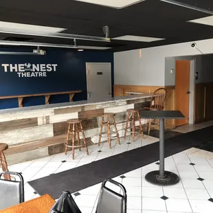 Enter and hang out in the lobby before the theatre opens.