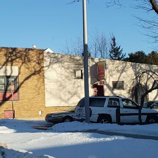 a stop sign on a snowy street