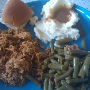 Chopped Pork BBQ, Mashed potatoes and gravy, green beans and roll.