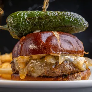 50/50 beef/chorizo patty, sambal mayo, grilled onion, pepper jack cheese, cilantro pesto on a pretzel bun. mmhh, mmhh!