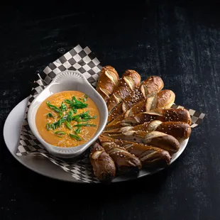 Our beer pretzel are served with our famous cheese Fondue Dip, yumm!!