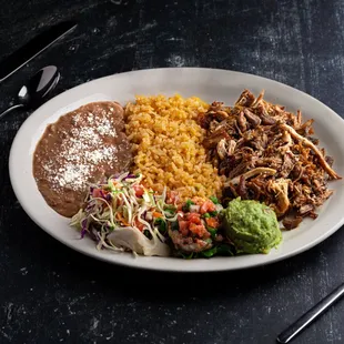 Succulent carnitas, r&amp;b, cabbage salad, guac, salsa, flour or corn.