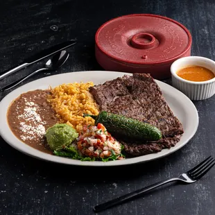 Seasoned just right Skirt steak, rice &amp; beans, side of guac &amp; pico, flour or corn tortillas.