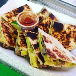 Herb-rubbed Steak and avocado quesadilla served with chipotle cilantro salsa