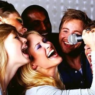 a group of people singing together