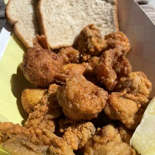 2 item combo w hush puppies, oysters,  and prawns (rice and beans not pictured)