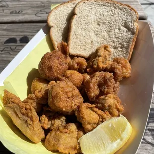 2 item combo w hush puppies, oysters,  and prawns (rice and beans not pictured)