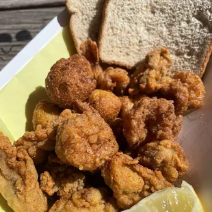 2 item combo w hush puppies, oysters,  and prawns (rice and beans not pictured)
