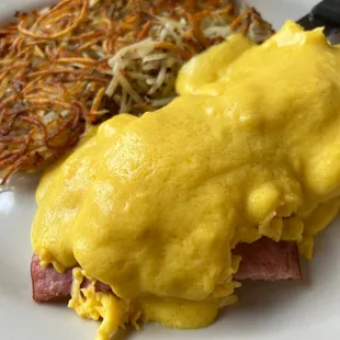 Classic eggs Benedict with scrambled eggs