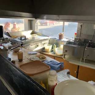 The cook area which you can watch from outside.