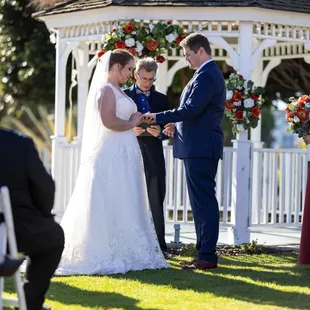 Newland Barn Wedding October 21, 2023  Photos by Tom Keene LAdigitalPhoto.com  Exchnaging the rings