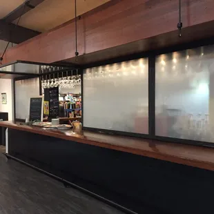 First Draft Book Bar setup with a serving window.