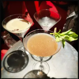 A trio cocktails - in front is Virginia Avenue (Wheatley vodka, lemon juice, simple cordial, St. Germain, raspberry, blueberry, Prosecco)
