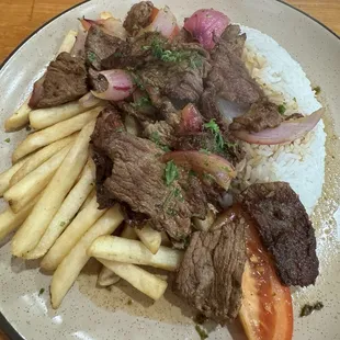 Tasteless and chewy lomo saltado.