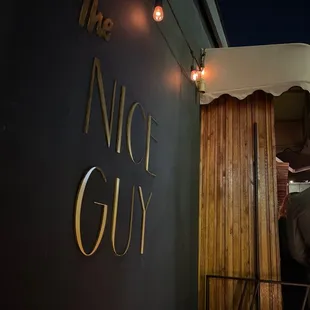 a man standing outside of a restaurant
