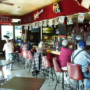 people sitting at the bar
