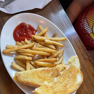 a grilled cheese sandwich with ketchup and ketchup