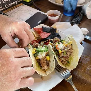 a man eating a taco
